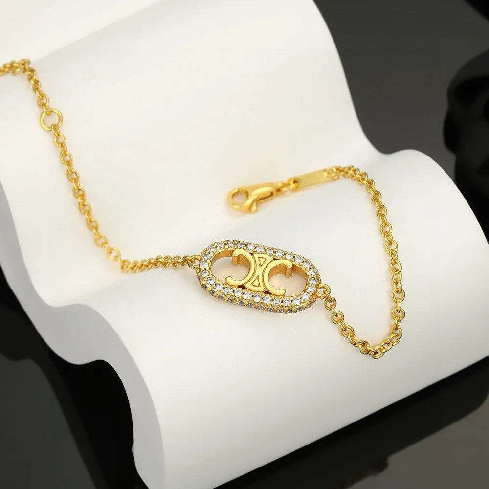 Celine Gold Finish Crystal Bracelet - Iconic Design