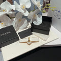 logo Prada White Gold Barrette - Prada White & Gold Logo Barrette