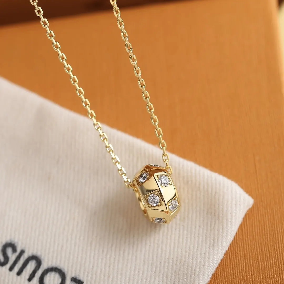 Louis Vuitton Gold Cylinder Diamond Pendant - Elegant Sparkle