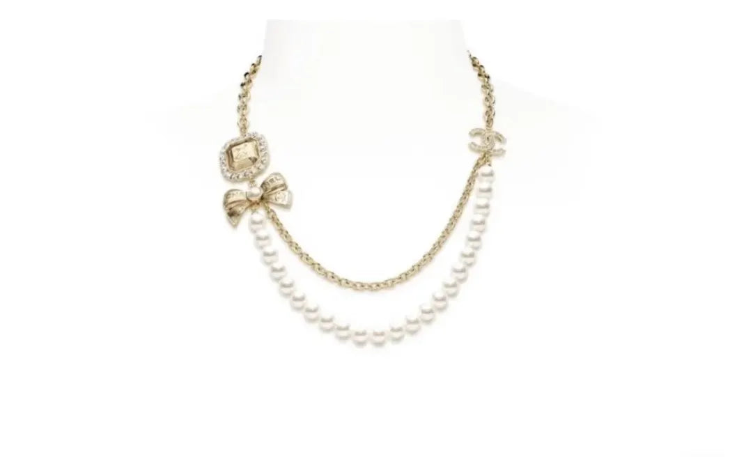 Chanel Gold Chain Pearl Bow Necklace - Designer Elegance