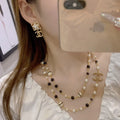 Chanel Gold Black White Pearl Necklace - CC Logo