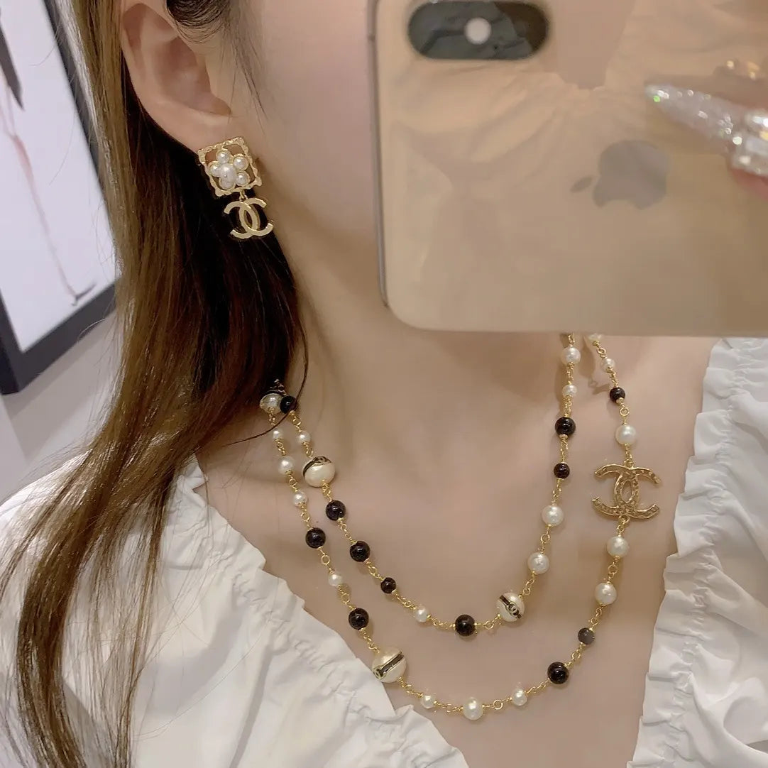 Chanel Gold Black White Pearl Necklace - CC Logo