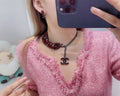 Chanel Burgundy Beaded Necklace - CC Logo Charm