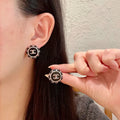 Chanel Black & Gold Button Earrings - Designer Chic