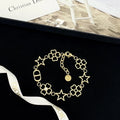 Dior Gold-Tone Star Flower Bracelet - Elegant Charm